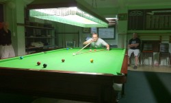 Mark Sharples playing a shot with the rest during the 2011 B grade final